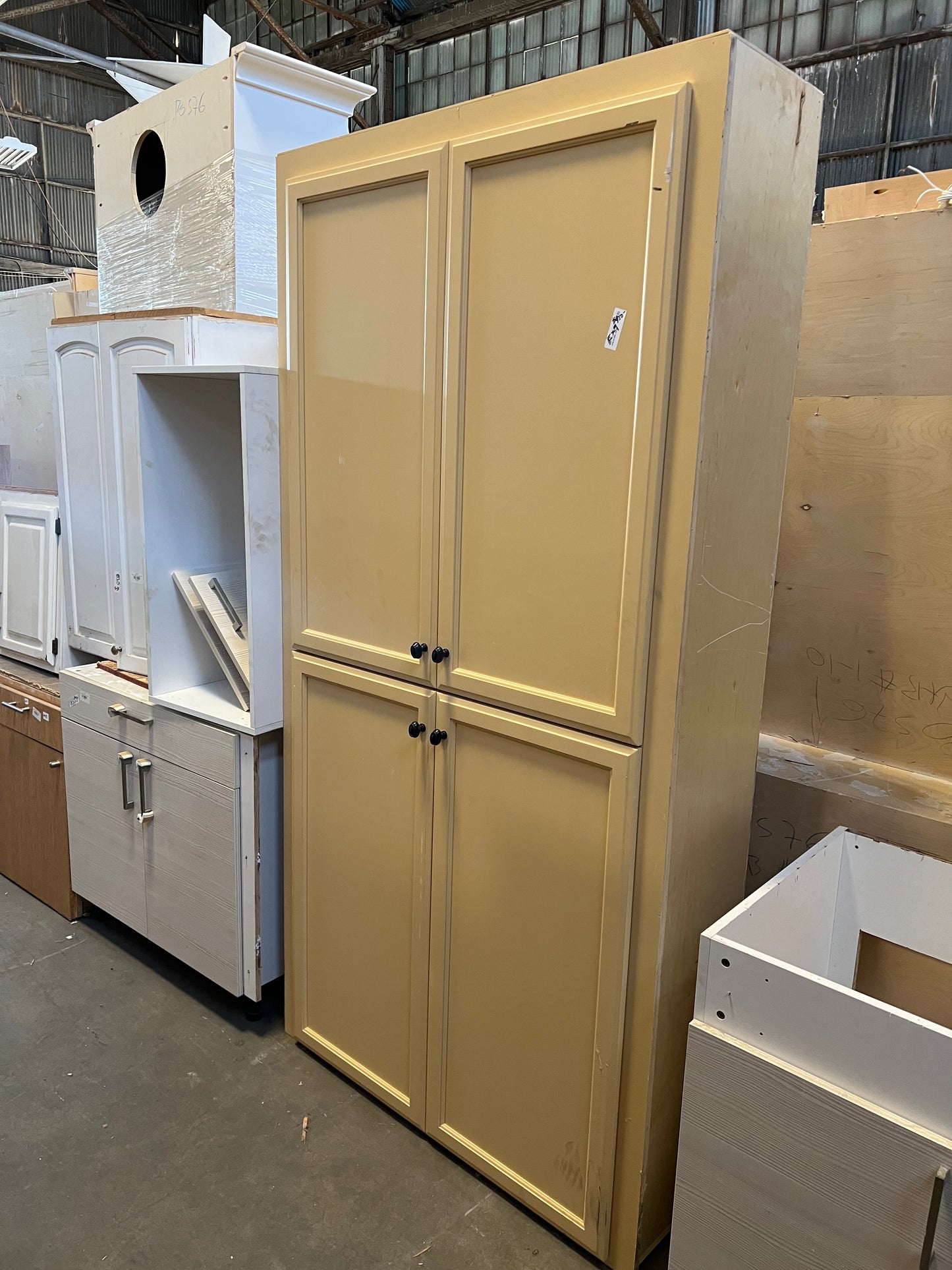 Tall cream pantry cabinet four door Oakland