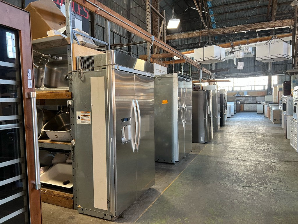 Reclaimed appliances aisle at The ReUse People Oakland warehouse