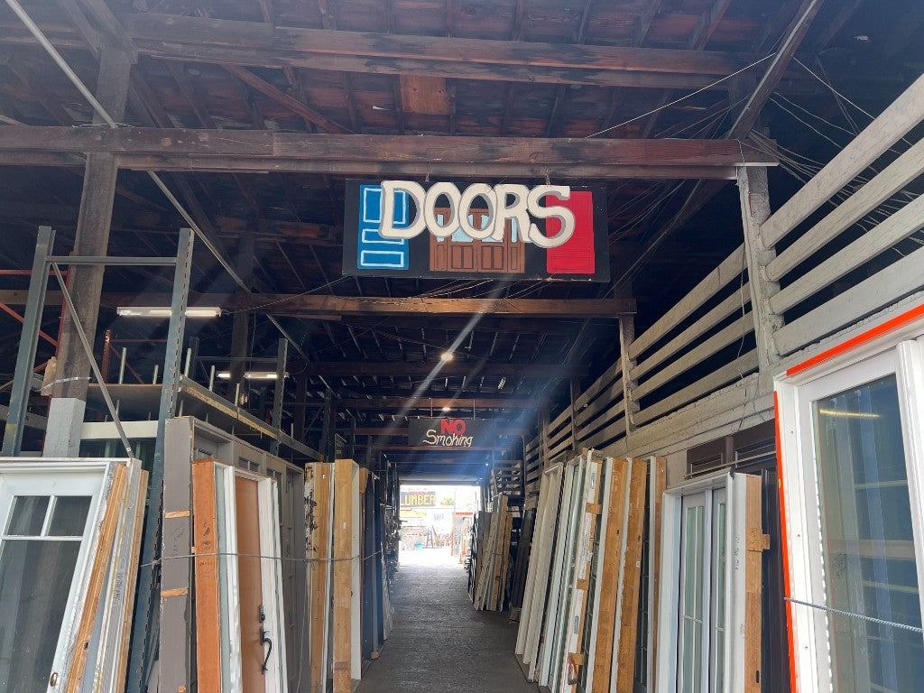 Reclaimed doors aisle at The ReUse People Oakland warehouse