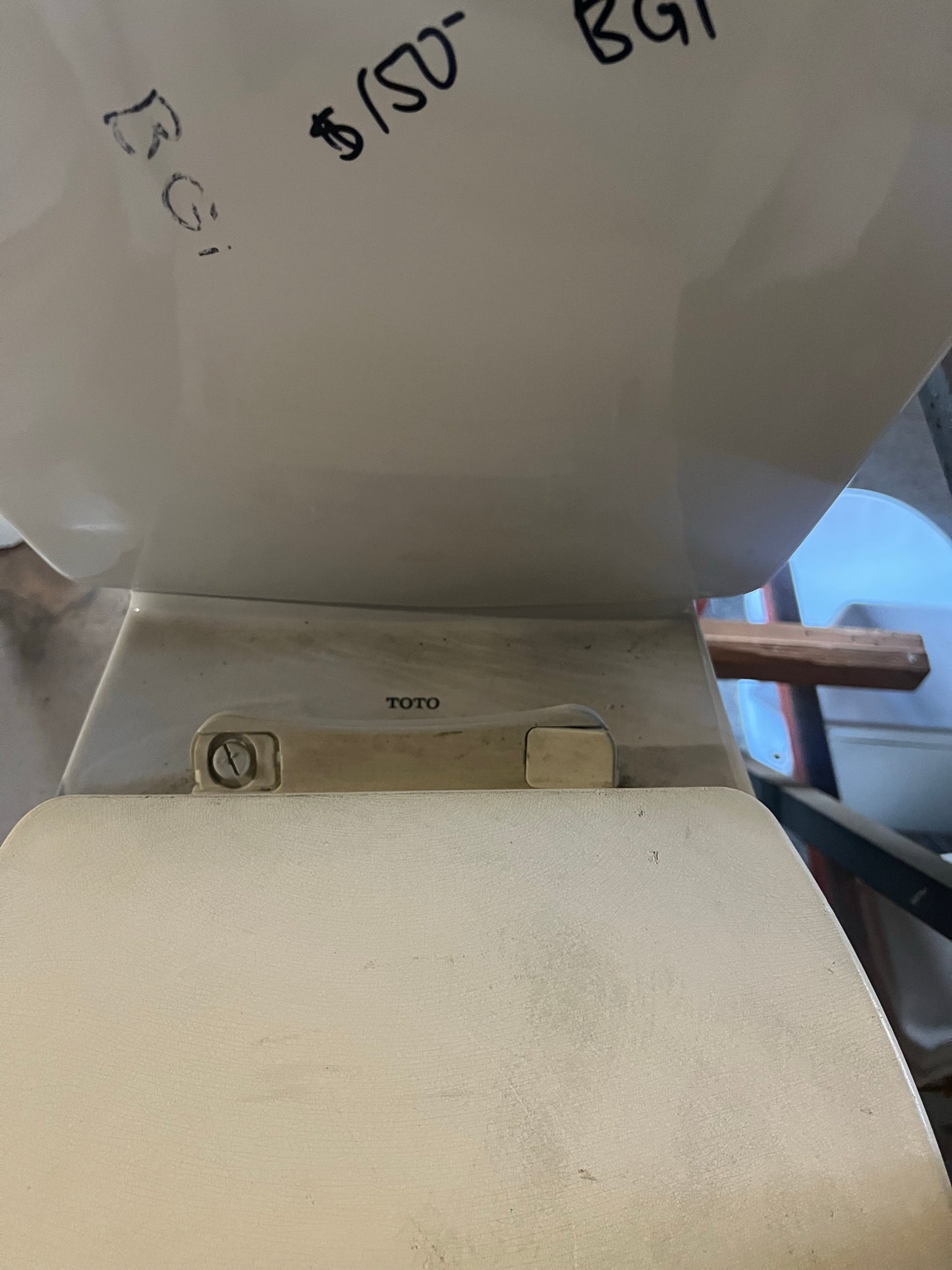Toto brand mark on toilet, BGI | The ReUse People Oakland